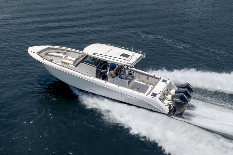 Slide: The Image of 2026 Everglades 375 Center Console boat cruising on open water. - 1