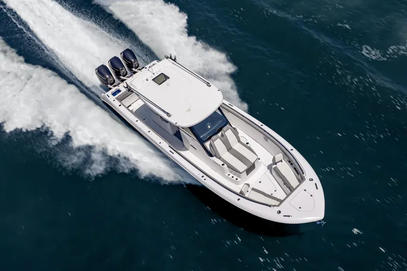 Slide: The Image of 2026 Everglades 375 Center Console boat cruising on open water, top view. - 4