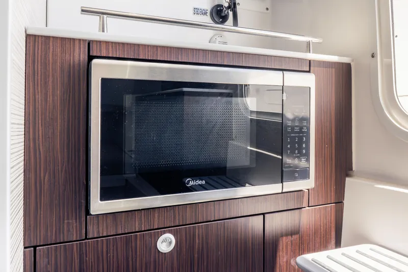 Slide: The Image of Built-in microwave in 2026 Everglades 375 Center Console boat kitchen. - 23