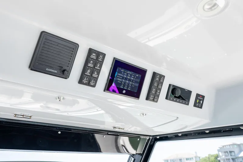 Slide: The Image of Control panel of 2026 Everglades 375 Center Console boat with Garmin display. - 12