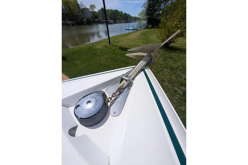 Slide: The Image of Bow of 2000 Cobalt 292 boat with anchor and winch by a lake. - 13