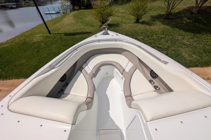 Slide: The Image of Bow seating area of a 2000 Cobalt 292 boat, featuring plush white upholstery. - 14