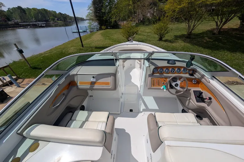 Slide: The Image of Interior view of a 2000 Cobalt 292 boat with seating and dashboard. - 16