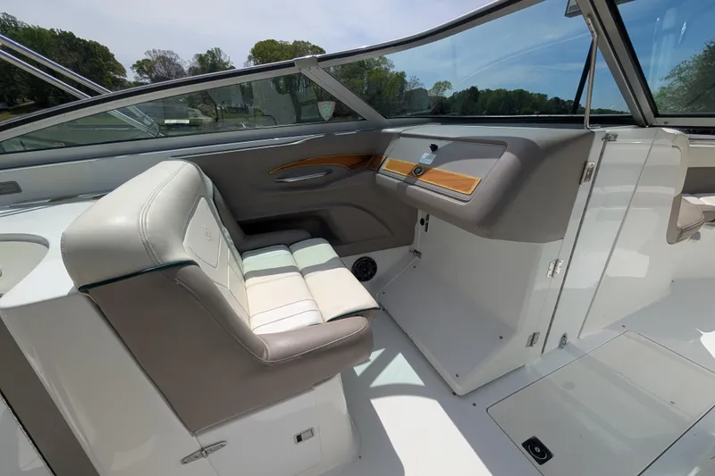 Slide: The Image of Interior of a 2000 Cobalt 292 boat, featuring sleek seating and modern dashboard design. - 9