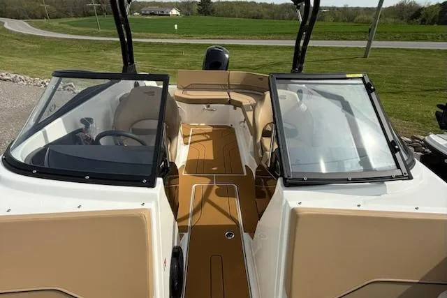 Slide: The Image of 2026 Bayliner V20 boat interior with tan seating and sleek design. - 10