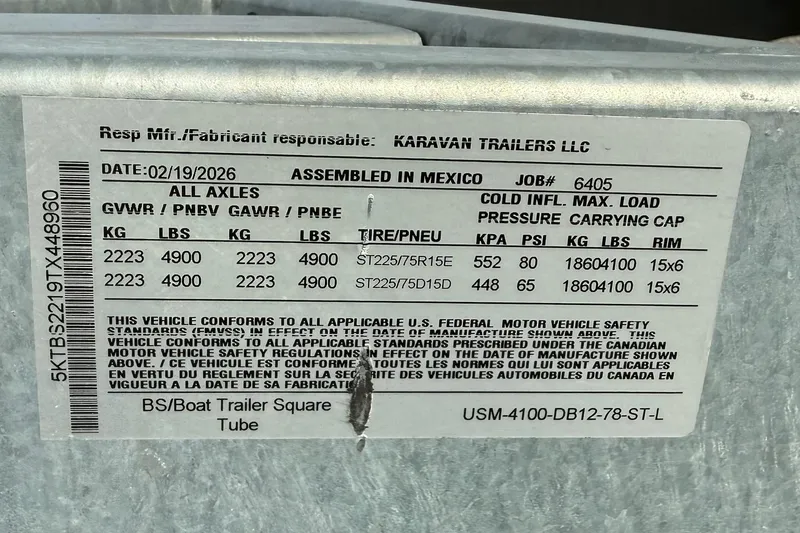 Slide: The Image of Label on a 2026 Bayliner V20 trailer, detailing weight and tire specifications. - 14