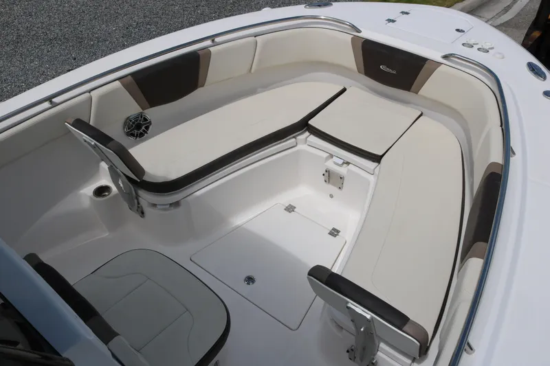 Slide: The Image of 2021 Robalo R272 Center Console boat interior with cushioned seating. - 10