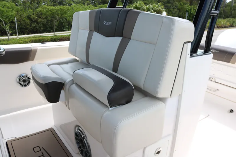 Slide: The Image of 2021 Robalo R272 Center Console boat seating with cushioned upholstery. - 12