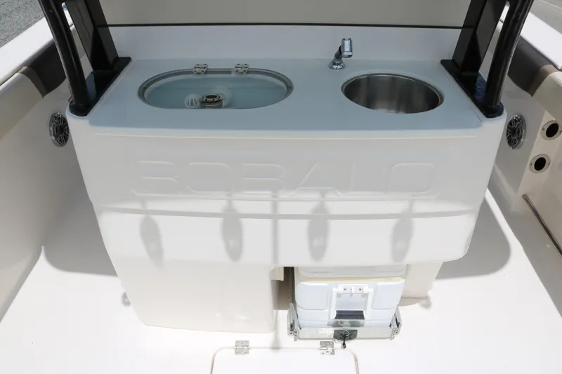 Slide: The Image of 2021 Robalo R272 Center Console boat with sink and storage area. - 14