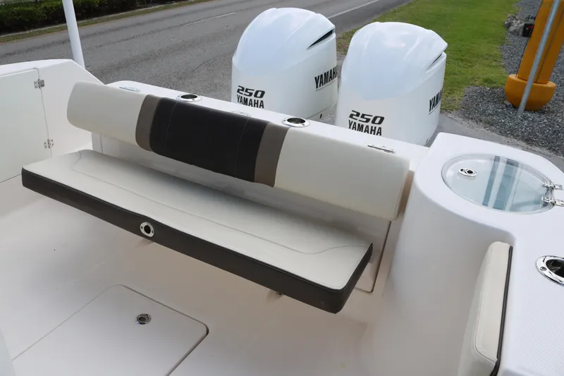 Slide: The Image of 2021 Robalo R272 Center Console boat with Yamaha 250 engines and seating area. - 16