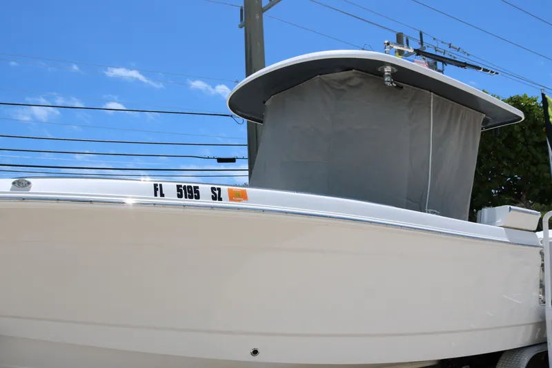 Slide: The Image of 2021 Robalo R272 Center Console boat with Florida registration, under clear blue sky. - 17