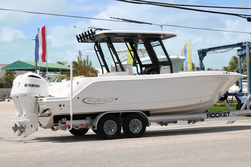 Slide: The Image of 2021 Robalo R272 Center Console boat on trailer with Yamaha engines. - 4