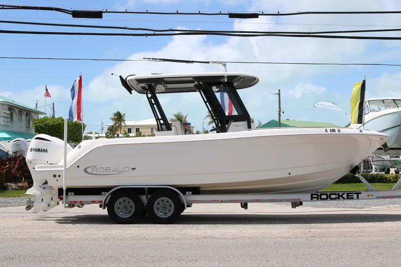 Slide: The Image of 2021 Robalo R272 Center Console boat on trailer, side view. - 5