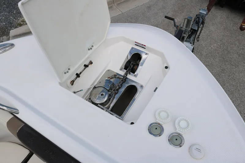 Slide: The Image of 2021 Robalo R272 Center Console boat anchor compartment and deck details. - 7