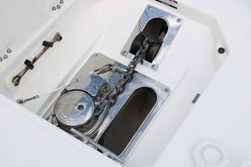Slide: The Image of Anchor chain and winch system on 2021 Robalo R272 Center Console boat. - 8