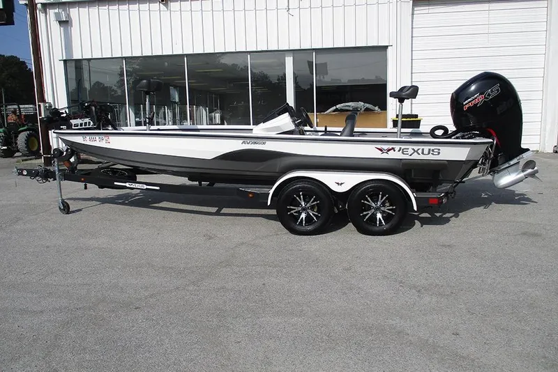 The Image of 2021 Vexus AVX 1980 boat on trailer, parked outside a building. - 1