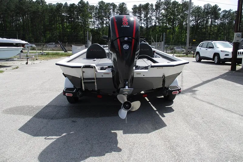 Slide: The Image of 2021 Vexus AVX 1980 boat with outboard motor, parked outdoors. - 10