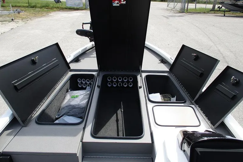 Slide: The Image of 2021 Vexus AVX 1980 boat storage compartments open, showcasing organized interior layout. - 14