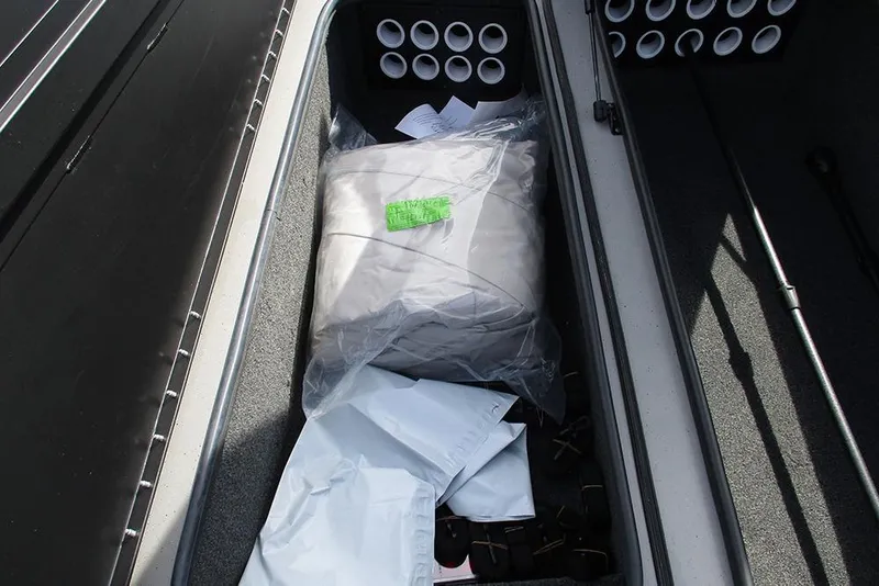 Slide: The Image of Storage compartment of a 2021 Vexus AVX 1980 boat with organized gear and accessories. - 15