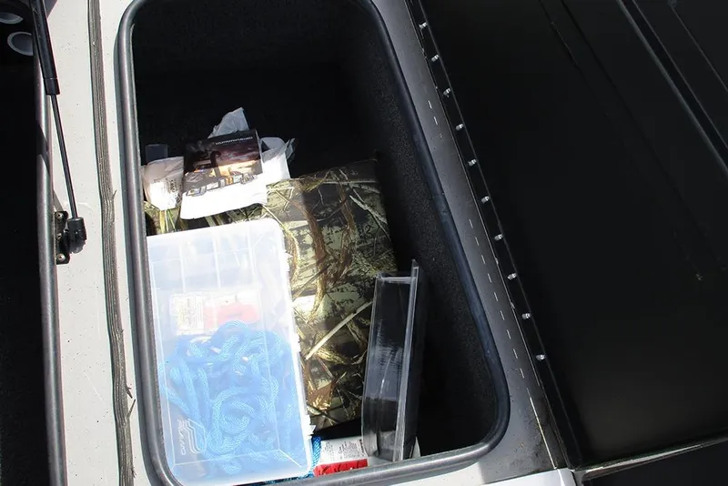 Slide: The Image of Storage compartment of 2021 Vexus AVX 1980 boat with various items inside. - 17