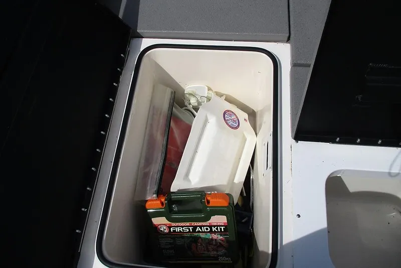 Slide: The Image of Storage compartment in 2021 Vexus AVX 1980 boat with first aid kit and supplies. - 21