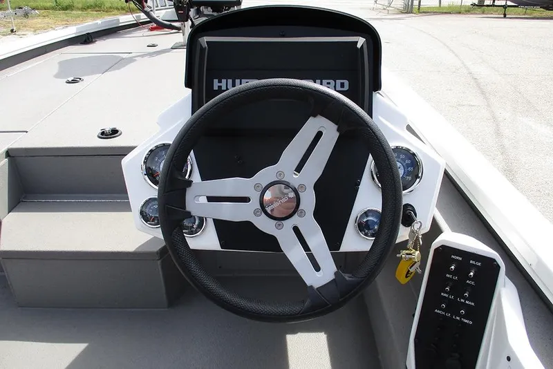 Slide: The Image of Steering wheel and dashboard of 2021 Vexus AVX 1980 boat, featuring control panel and gauges. - 24