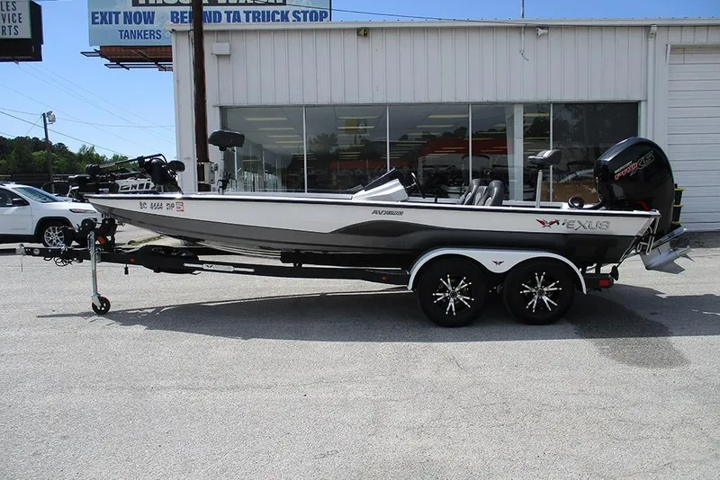 Slide: The Image of 2021 Vexus AVX 1980 boat on trailer, parked outside a building. - 3