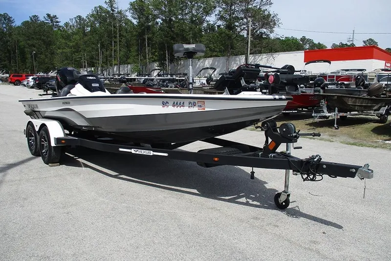 Slide: The Image of 2021 Vexus AVX 1980 boat on trailer in outdoor dealership lot. - 7