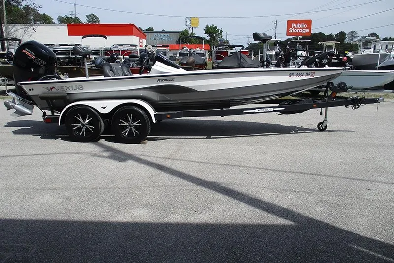 Slide: The Image of 2021 Vexus AVX 1980 boat on trailer in outdoor storage area. - 8