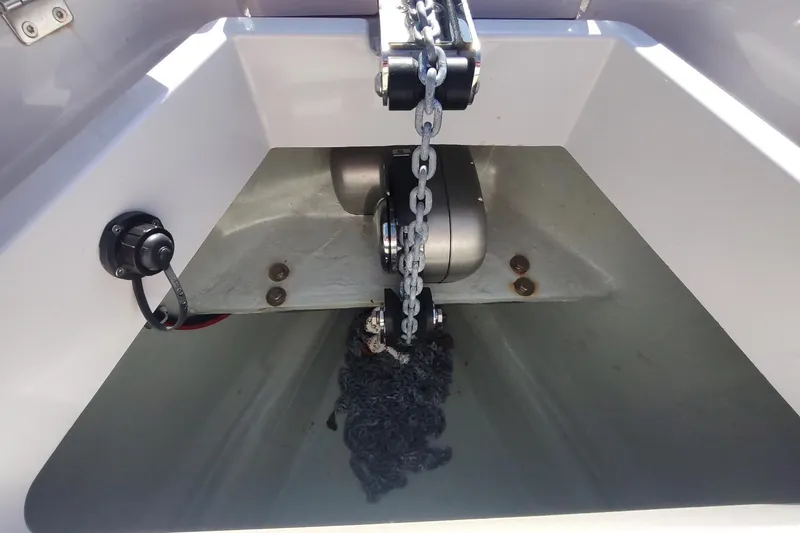 Slide: The Image of Anchor chain compartment of 2023 RYCK 280 boat, featuring a modern winch system. - 42