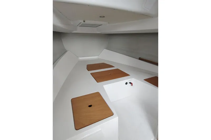 Slide: The Image of Interior cabin of 2023 RYCK 280 boat with wooden accents and white finish. - 47
