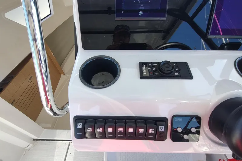 Slide: The Image of Control panel of 2023 RYCK 280 boat with navigation and switch controls. - 24