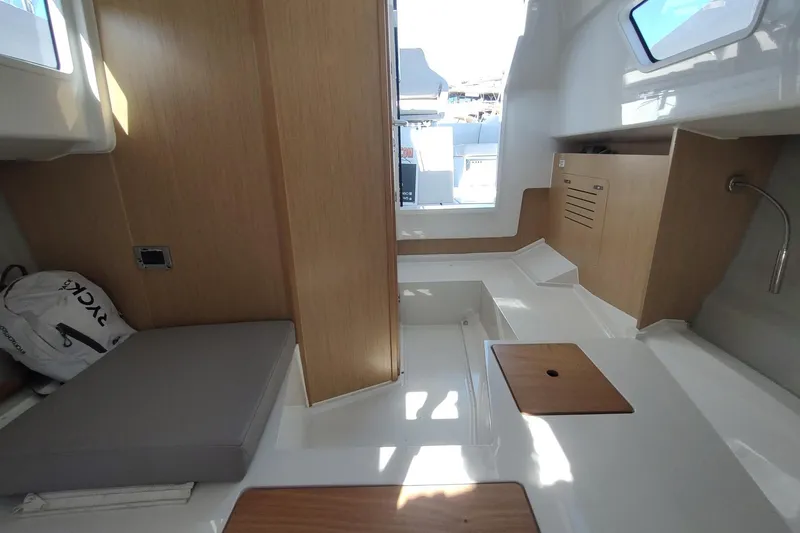 Slide: The Image of Interior of 2023 RYCK 280 boat with modern wood and white design elements. - 50