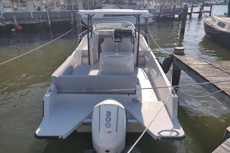 Slide: The Image of RYCK 280 boat docked, rear view showing seating and Mercury 300 V8 engine. - 8
