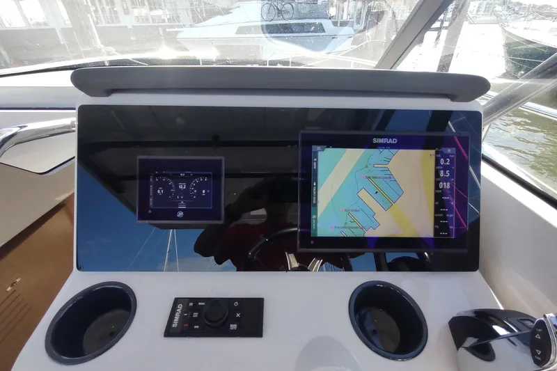 Slide: The Image of RYCK 280 boat dashboard with Simrad navigation display, 2023 model. - 22
