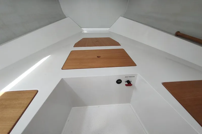 Slide: The Image of Interior of 2023 RYCK 280 boat with wooden panels and bow thruster control. - 48