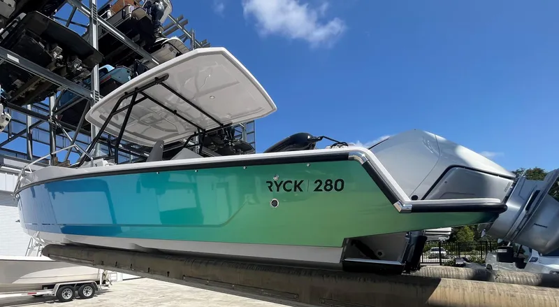 Slide: The Image of 2023 RYCK 280 boat on a storage rack. - 4