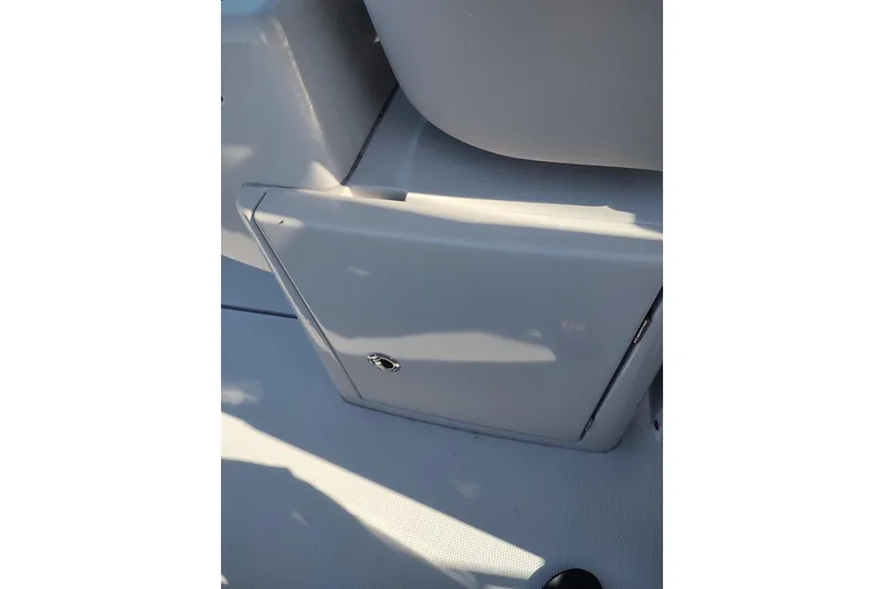 Slide: The Image of RYCK 280 boat storage compartment, 2023 model, featuring sleek design and secure latch. - 35
