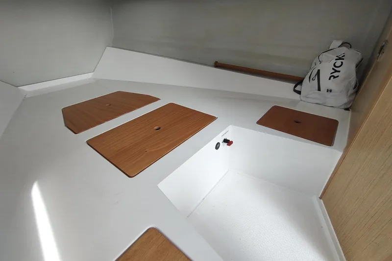 Slide: The Image of Interior cabin of 2023 RYCK 280 boat with wooden panels and storage compartments. - 49