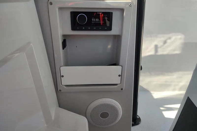 Slide: The Image of Control panel and speaker on 2023 RYCK 280 boat interior. - 25