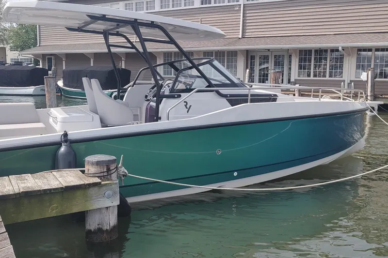 Slide: The Image of 2023 RYCK 280 boat docked at marina, featuring sleek design and modern amenities. - 1