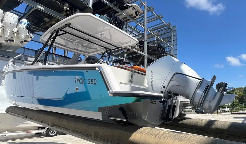 Slide: The Image of 2023 RYCK 280 boat on storage rack, exterior view. - 6