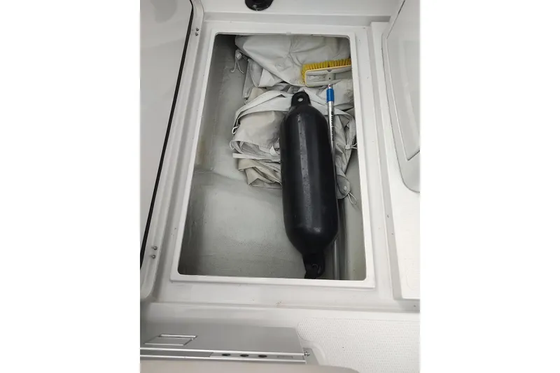 Slide: The Image of Storage compartment on 2023 RYCK 280 boat with fender and equipment. - 28
