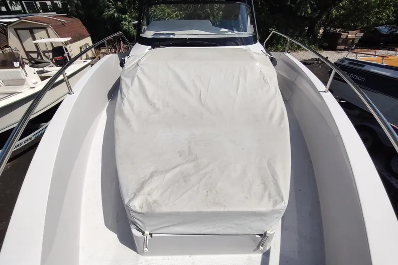 Slide: The Image of 2023 RYCK 280 boat with covered seating area, docked outdoors. - 57
