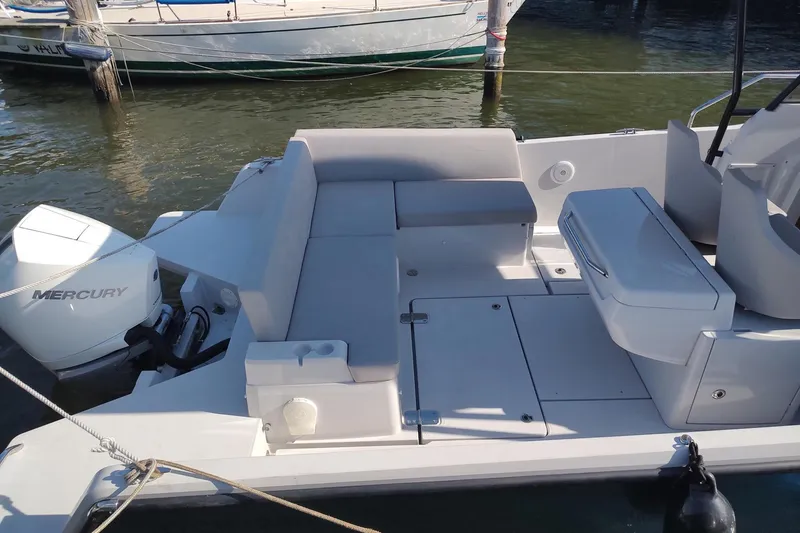 Slide: The Image of 2023 RYCK 280 boat with Mercury engine, featuring spacious seating and modern design. - 12