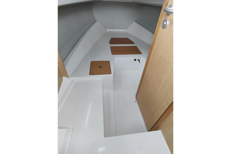 Slide: The Image of Interior cabin of 2023 RYCK 280 boat with wooden accents and sleek design. - 45