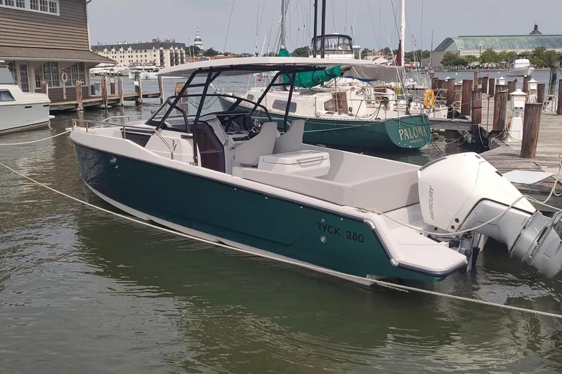 The Image of 2023 RYCK 280 boat docked at marina, featuring sleek design and powerful outboard motor. - 0