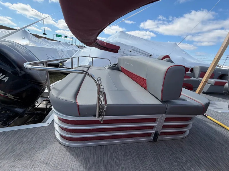 Slide: The Image of 2022 Bennington 20 LSB pontoon boat with gray and red seating. - 11