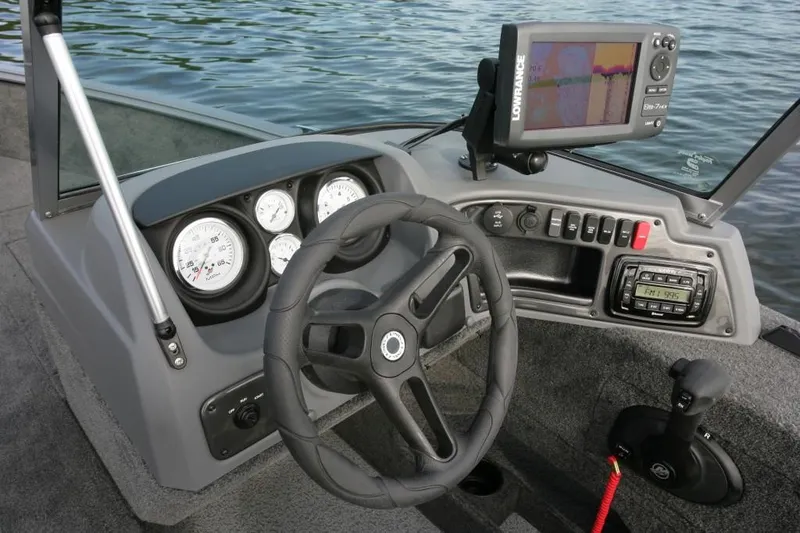 The Image of 2017 Lund 1775 Impact SS boat on trailer, covered, parked outdoors. - 2