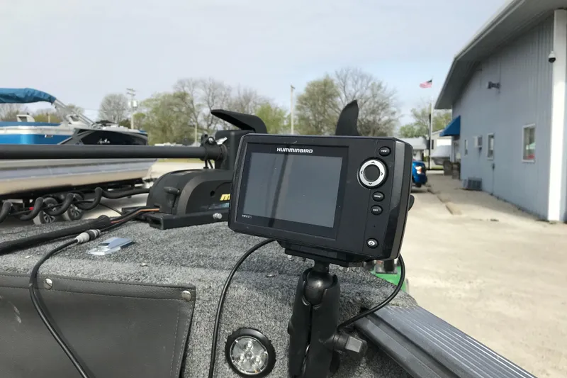 Slide: The Image of Fishfinder on 2017 Lund 1775 Impact SS boat, docked near a building. - 21